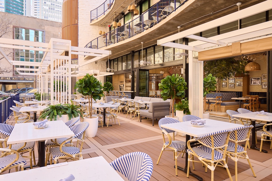 the hampton social dallas whitewashed oak wood chairs blue bistro chairs outdoor patio