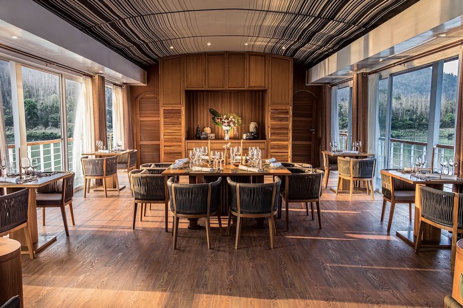 mekong kingdoms boheme luxury river cruise loatian motifs wood dining area