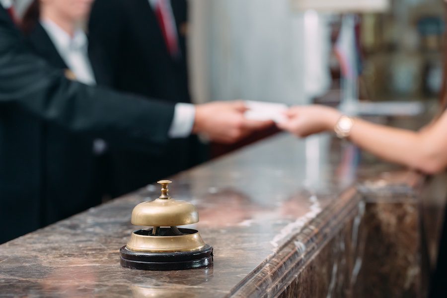 Picture of guests getting key card in hotel
