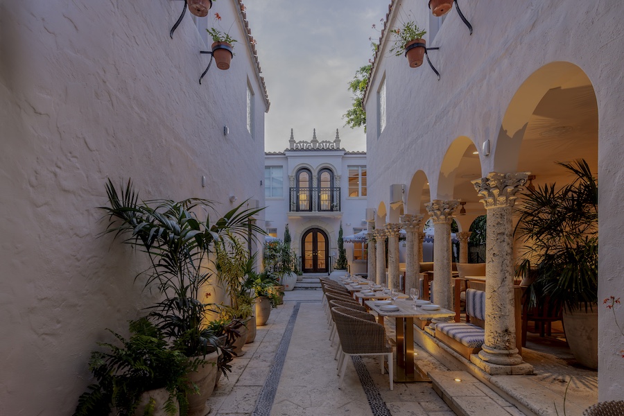 Donatella Exterior miami beach art deco district Mediterranean revival white stucco outdoor dining columns plants