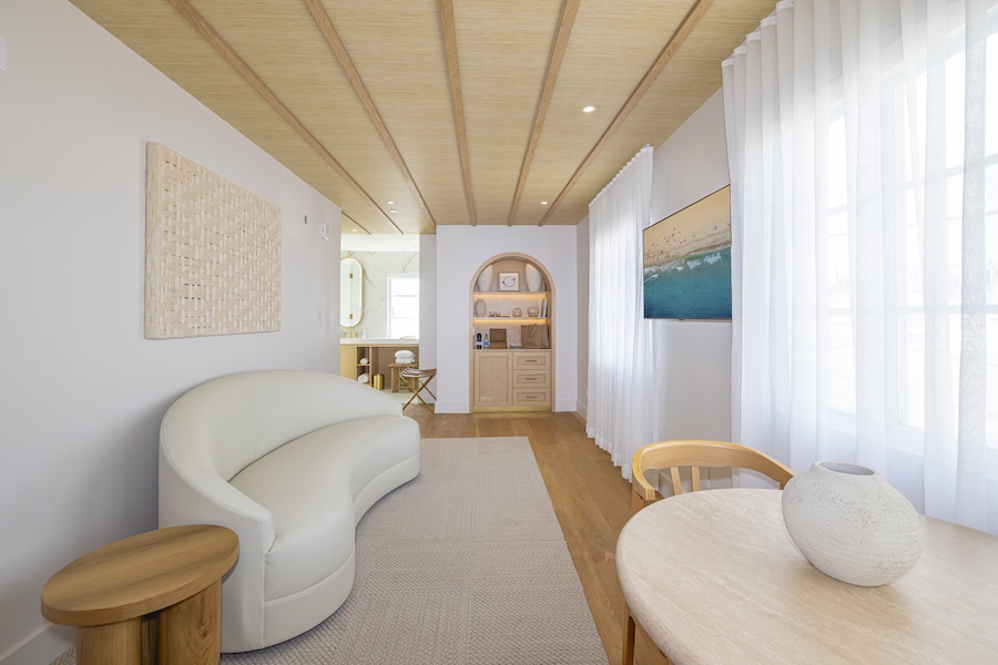 Donatella hotel miami beach art deco district modern Mediterranean white marble light wood sitting area curved couch