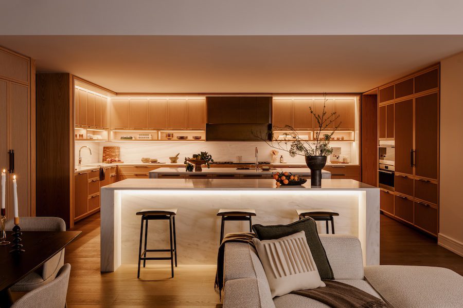 rosewood hotel branded residences beverly hills los angeles california kitchen underlit cabinets island bar stools