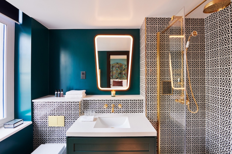 The Other House Covent Garden london interior apartment style hotel with private club british maximalism tiled shower dark blue teal walls bathroom